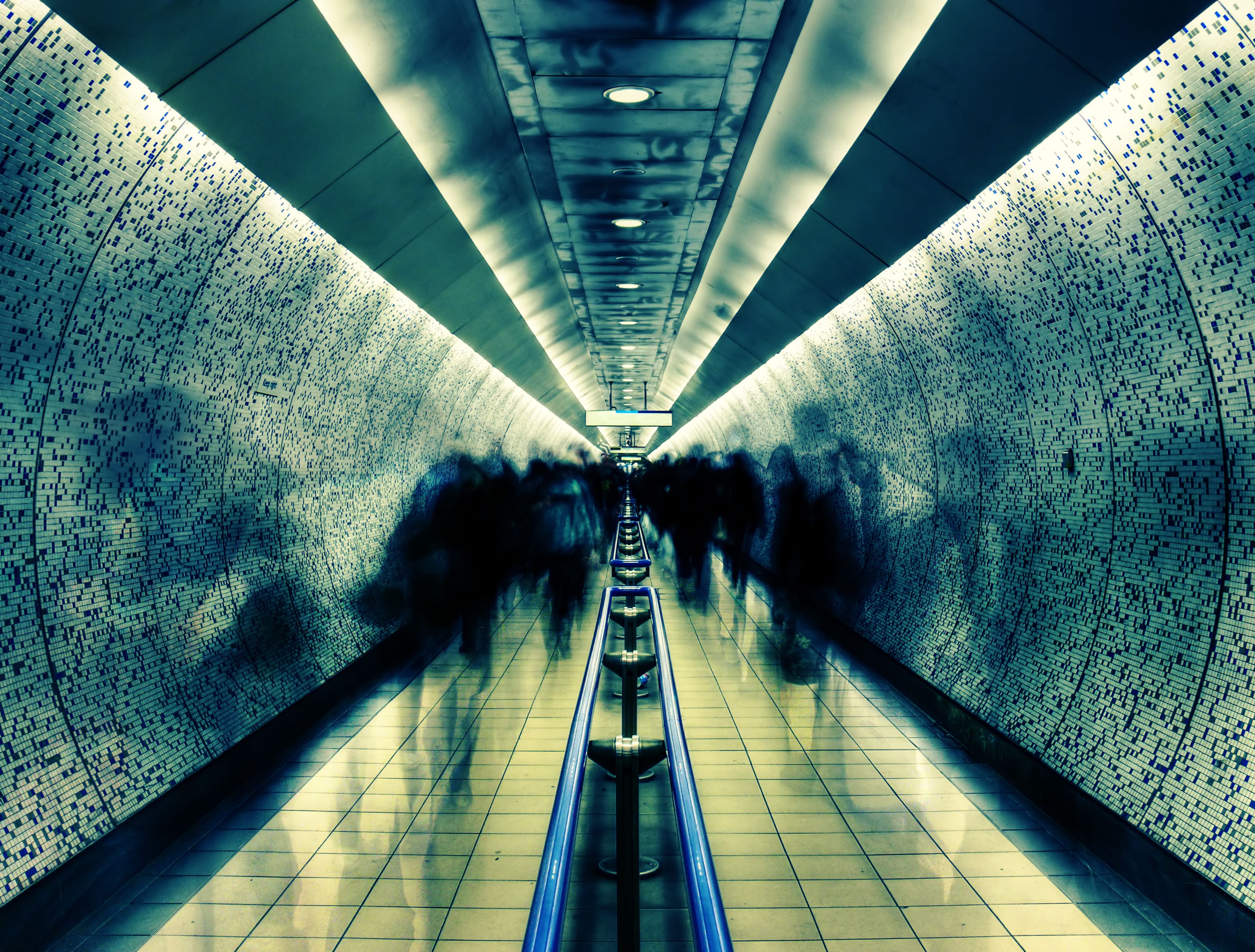 London underground station with people in motion 