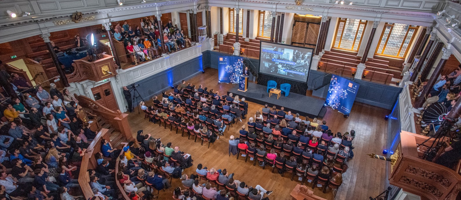 Demis Hassabis delivering his Tanner Lecture to an audience in the Sheldonian Theatre