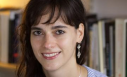 A profile picture of Dr Carissa Véliz set against the backdrop of a library