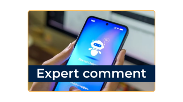 Expert comment: Phone in hands with bot on the screen